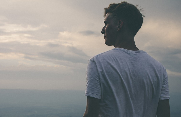 Man Looking Out At Sky